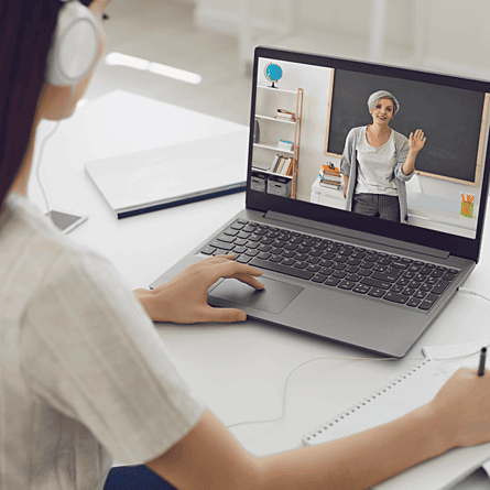 Lady with headphones on watching a course online